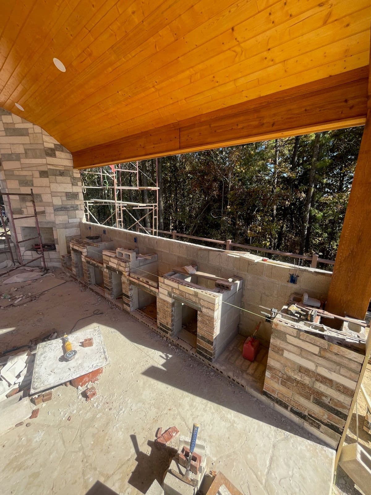 Stone Outdoor Kitchen and Pergola Masterpiece